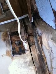 Broken rotten wood beam forward of AC